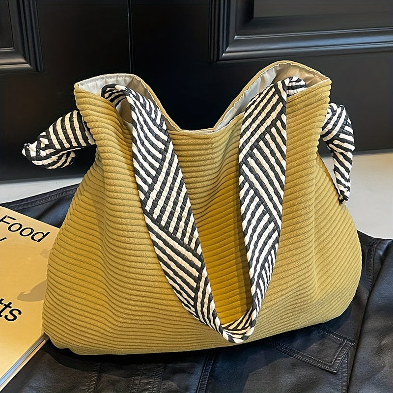Grey corduroy tote bag with soft plush interior lining and magnetic closure for daily commuting